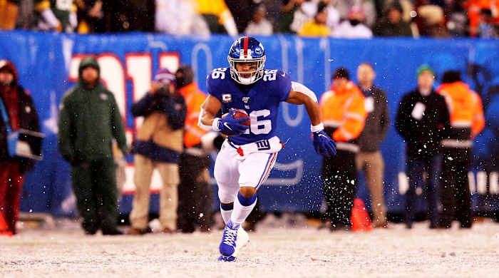 Dec 1, 2019; East Rutherford, NJ, USA; New York Giants running back Saquon Barkley (26) runs the ball against the Green Bay Packers during the fourth quarter at MetLife Stadium. Mandatory Credit: Brad Penner-USA TODAY Sports